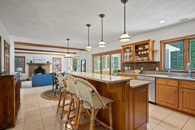 12 Coombs Cir, Newburyport, MA 01950 - kitchen featuring stainless steel dishwasher, light tile patterned floors, plenty of natural light, decorative backsplash, and recessed lighting