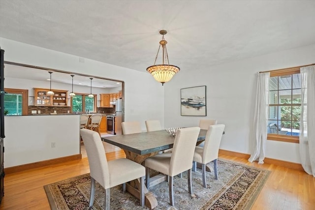 12 Coombs Cir, Newburyport, MA 01950 - dining space featuring light wood-style flooring and baseboards