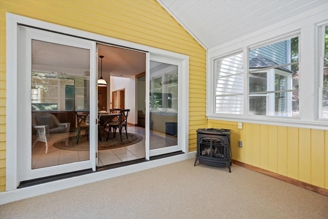 12 Coombs Cir, Newburyport, MA 01950 - sunroom featuring a wood stove, healthy amount of natural light, and lofted ceiling