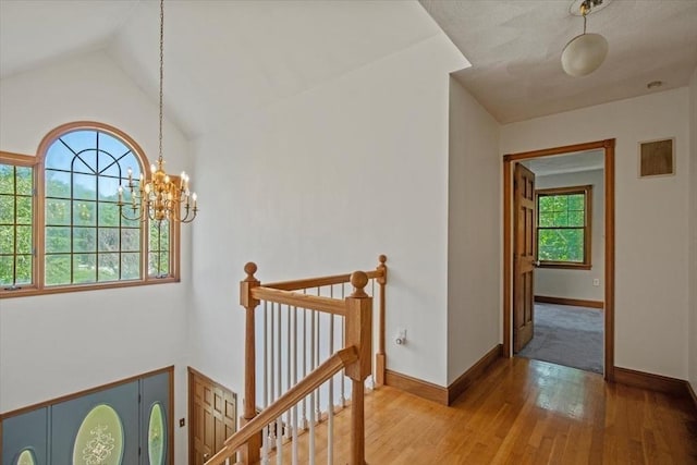 12 Coombs Cir, Newburyport, MA 01950 - hallway featuring an upstairs landing, plenty of natural light, wood-type flooring, lofted ceiling, and a chandelier