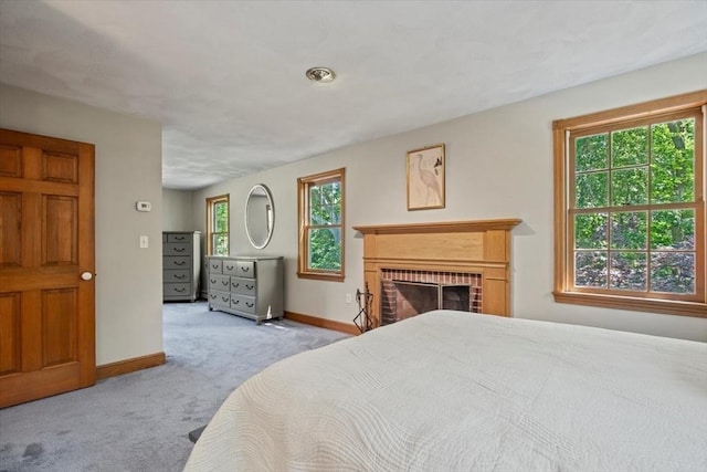 12 Coombs Cir, Newburyport, MA 01950 - carpeted bedroom with baseboards and a brick fireplace