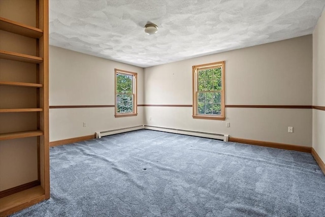 12 Coombs Cir, Newburyport, MA 01950 - carpeted empty room featuring a textured ceiling and a baseboard heating unit