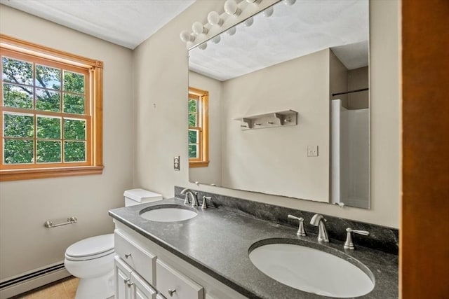 12 Coombs Cir, Newburyport, MA 01950 - full bathroom featuring a baseboard heating unit, double vanity, and tile patterned floors