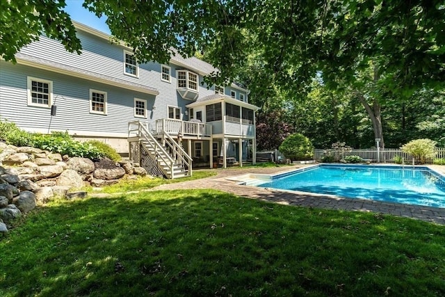 12 Coombs Cir, Newburyport, MA 01950 - view of swimming pool featuring a sunroom, stairway, a fenced backyard, and a wooden deck