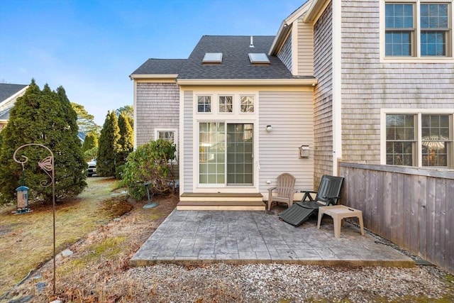 back of house with a patio