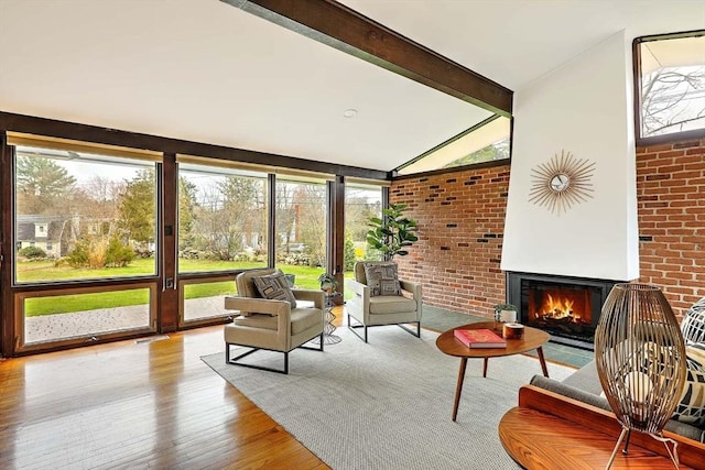 622 Pike Ave, Attleboro, MA 02703 - sunroom / solarium featuring beam ceiling, visible vents, and an outdoor living space with a fireplace