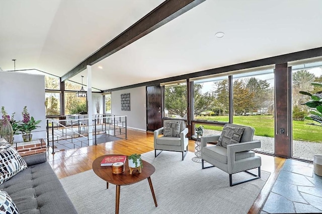 622 Pike Ave, Attleboro, MA 02703 - living room with vaulted ceiling with beams, a healthy amount of sunlight, and wood finished floors