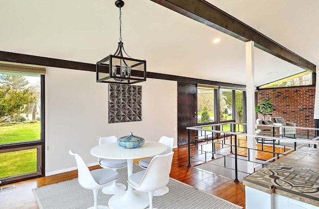 622 Pike Ave, Attleboro, MA 02703 - dining room with visible vents, a notable chandelier, wood finished floors, and plenty of natural light