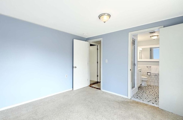 622 Pike Ave, Attleboro, MA 02703 - unfurnished bedroom featuring visible vents, connected bathroom, baseboards, and carpet floors