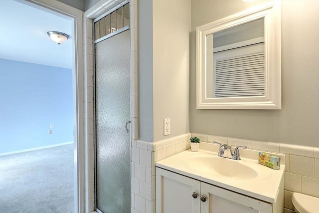 622 Pike Ave, Attleboro, MA 02703 - bathroom with toilet, vanity, a shower stall, and tile walls