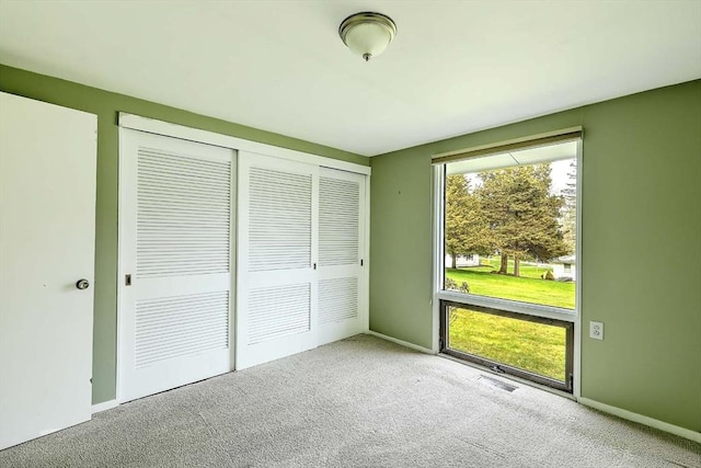 622 Pike Ave, Attleboro, MA 02703 - unfurnished bedroom with a closet, carpet floors, and baseboards
