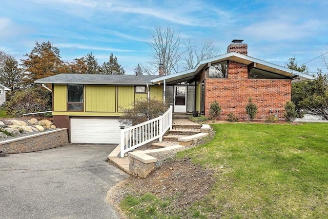 622 Pike Ave, Attleboro, MA 02703 - ranch-style house featuring aphalt driveway, a chimney, a front lawn, brick siding, and a garage