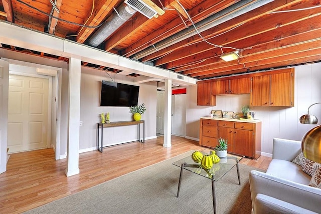 622 Pike Ave, Attleboro, MA 02703 - finished basement featuring visible vents, light wood finished floors, and baseboards