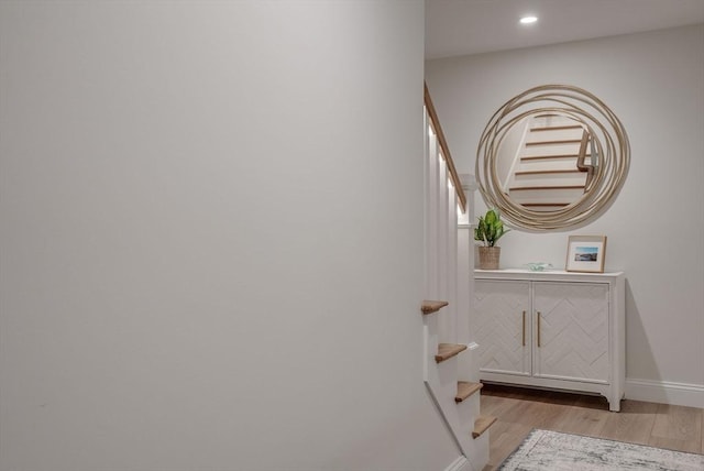 interior space featuring recessed lighting, wood finished floors, and baseboards