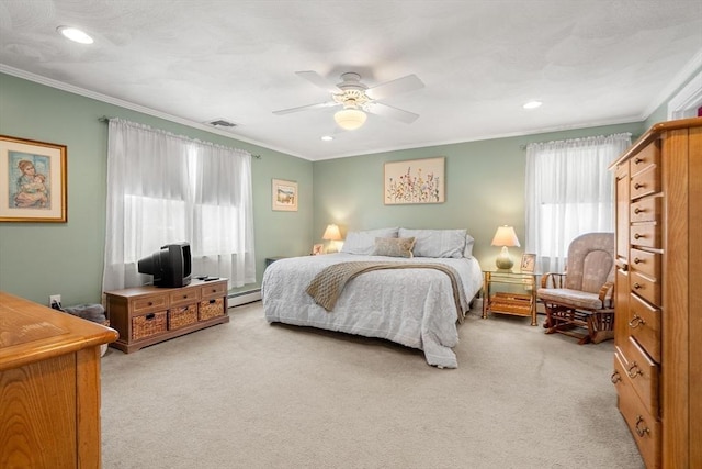 bedroom featuring multiple windows, ornamental molding, and light colored carpet