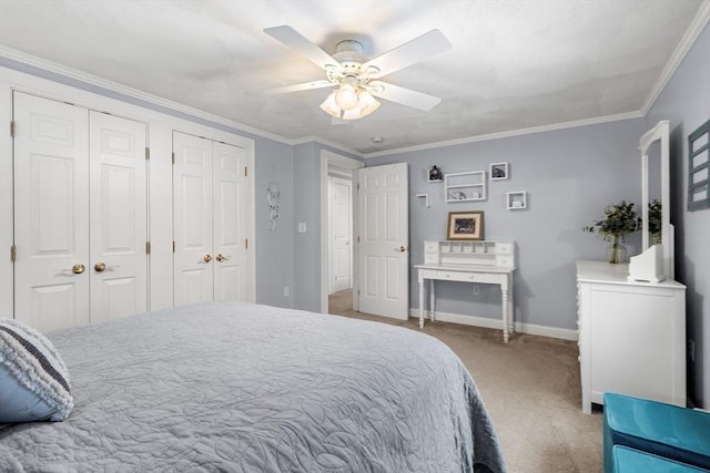 bedroom with light carpet, ornamental molding, two closets, and baseboards