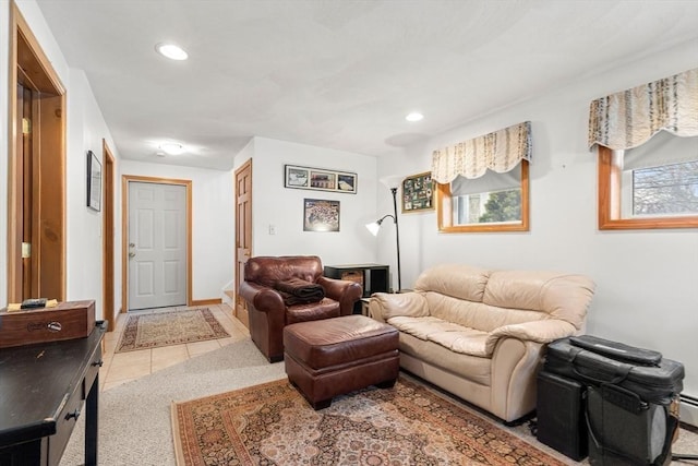 living room with baseboards, light tile patterned flooring, and recessed lighting