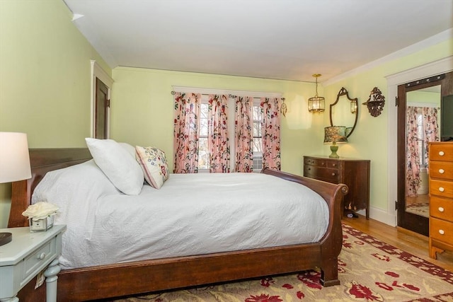 bedroom featuring wood finished floors