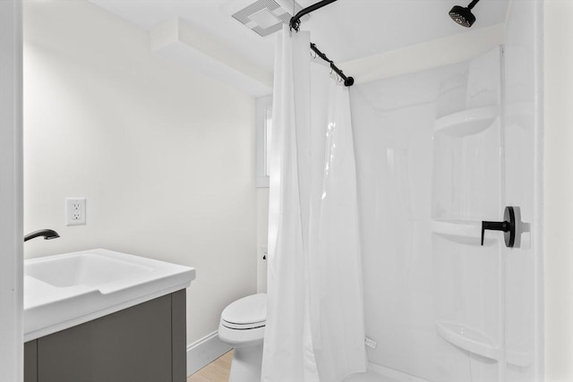 bathroom with visible vents, a shower with curtain, vanity, and toilet