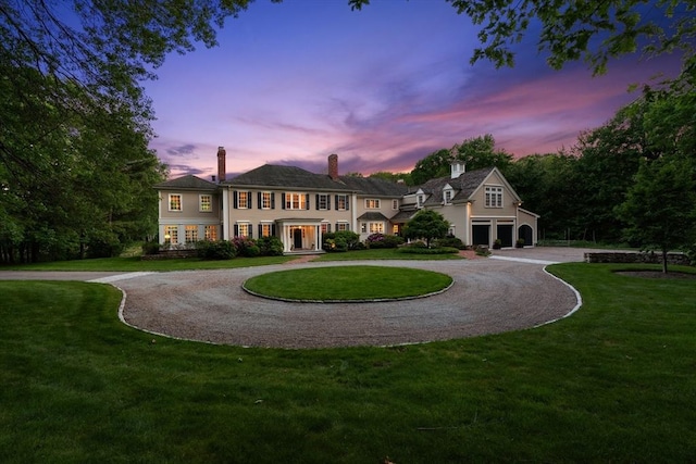 26 Longmeadow Dr, Westwood, MA 02090 - view of front of property with curved driveway, a chimney, and a front lawn