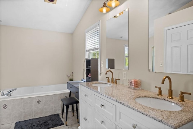 bathroom with tile patterned floors, a bath, double vanity, and lofted ceiling