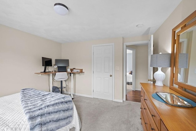 bedroom featuring carpet flooring and baseboards