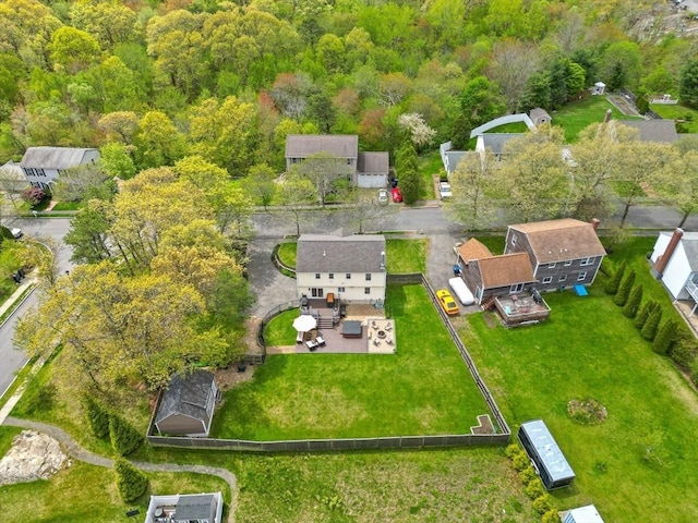 aerial view of residential area featuring a heavily wooded area