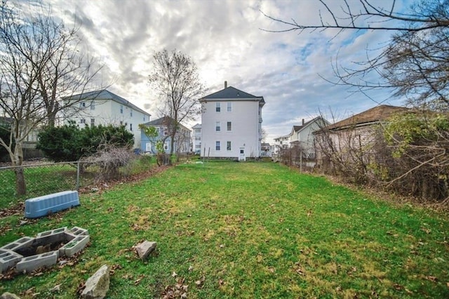 view of yard featuring a vegetable garden and fence