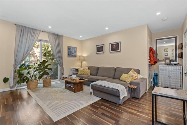 living area with wood finished floors, recessed lighting, and baseboards