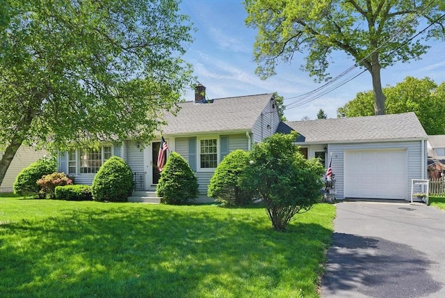 31 Fallston St, Springfield, MA 01119 - view of front of property featuring concrete driveway, a front yard, a chimney, and an attached garage