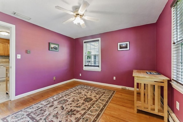 31 Fallston St, Springfield, MA 01119 - unfurnished bedroom featuring multiple windows, wood finished floors, baseboards, and ceiling fan