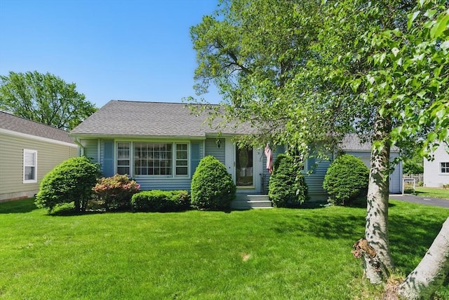 31 Fallston St, Springfield, MA 01119 - view of front of house featuring a front yard and roof with shingles
