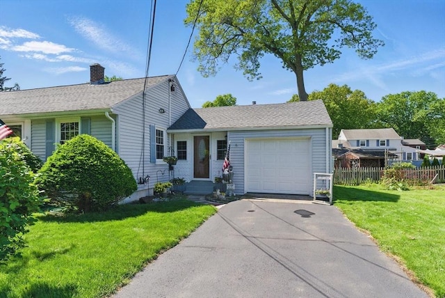 31 Fallston St, Springfield, MA 01119 - view of front facade with an attached garage, driveway, and a chimney