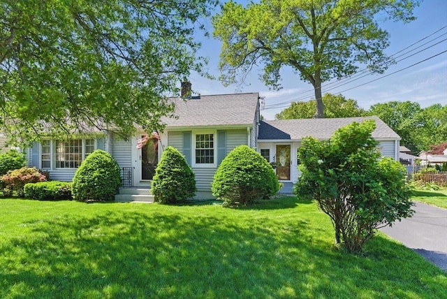 31 Fallston St, Springfield, MA 01119 - view of front of home featuring a front lawn and a chimney