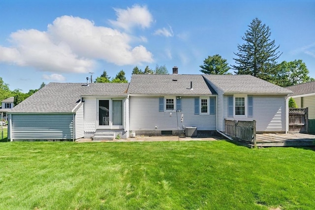 31 Fallston St, Springfield, MA 01119 - rear view of house with a wooden deck, a chimney, a yard, roof with shingles, and cooling unit