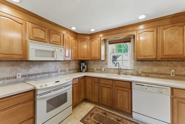 31 Fallston St, Springfield, MA 01119 - kitchen featuring white appliances, a sink, backsplash, brown cabinets, and recessed lighting