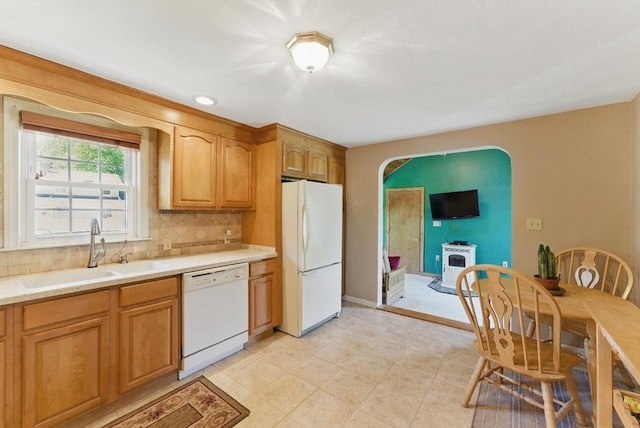 31 Fallston St, Springfield, MA 01119 - kitchen featuring white appliances, a sink, tasteful backsplash, light countertops, and brown cabinets