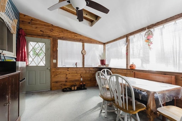 sunroom with lofted ceiling and ceiling fan