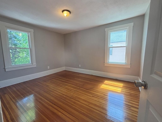 723 White St, Springfield, MA 01108 - unfurnished room with plenty of natural light, dark wood-style flooring, and baseboards