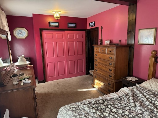 carpeted bedroom with a closet