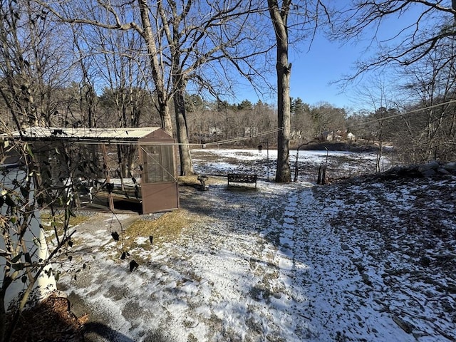 view of yard layered in snow