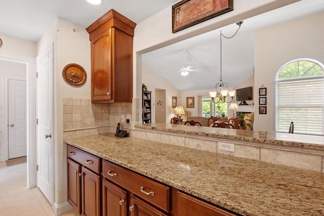31 Shaker Hill Rd Unit 31, Hooksett, NH 03106 - kitchen featuring healthy amount of natural light, light stone counters, a ceiling fan, backsplash, and lofted ceiling