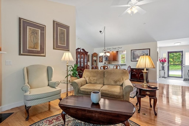31 Shaker Hill Rd Unit 31, Hooksett, NH 03106 - living room with lofted ceiling, ceiling fan, light wood finished floors, and a chandelier