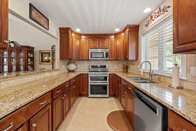 31 Shaker Hill Rd Unit 31, Hooksett, NH 03106 - kitchen featuring appliances with stainless steel finishes, light stone countertops, tasteful backsplash, and recessed lighting