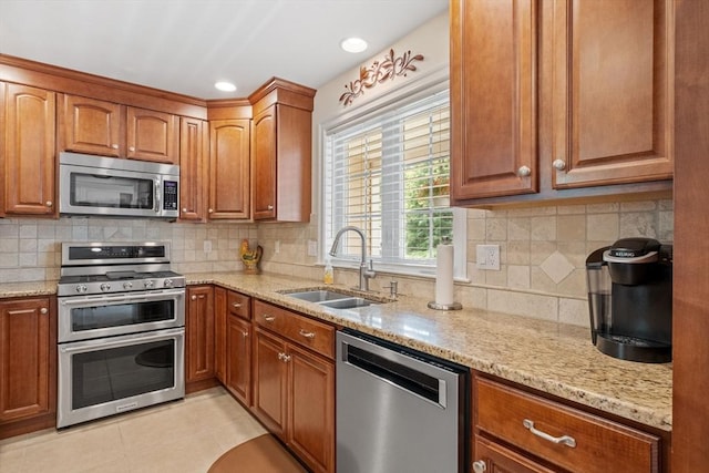 31 Shaker Hill Rd Unit 31, Hooksett, NH 03106 - kitchen featuring stainless steel appliances, light stone countertops, decorative backsplash, and recessed lighting
