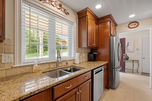 31 Shaker Hill Rd Unit 31, Hooksett, NH 03106 - kitchen with appliances with stainless steel finishes, brown cabinetry, healthy amount of natural light, and recessed lighting