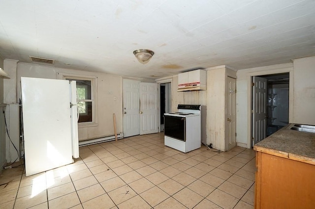 135 Elm St, Southbridge, MA 01550 - kitchen featuring white appliances, a baseboard radiator, under cabinet range hood, light tile patterned flooring, and white cabinetry