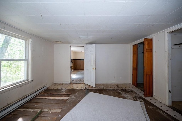 135 Elm St, Southbridge, MA 01550 - basement featuring a baseboard radiator and plenty of natural light