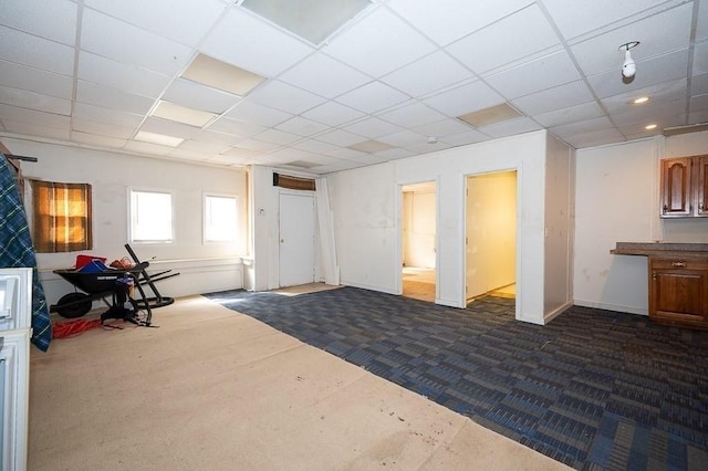 135 Elm St, Southbridge, MA 01550 - below grade area featuring dark carpet and a paneled ceiling