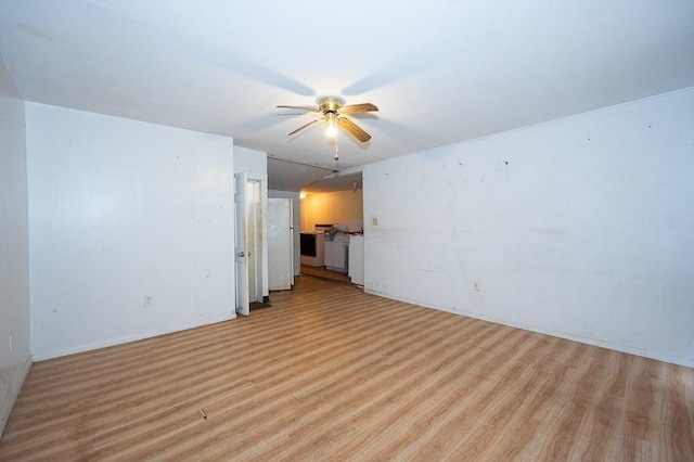 135 Elm St, Southbridge, MA 01550 - unfurnished living room featuring light wood-style flooring and a ceiling fan
